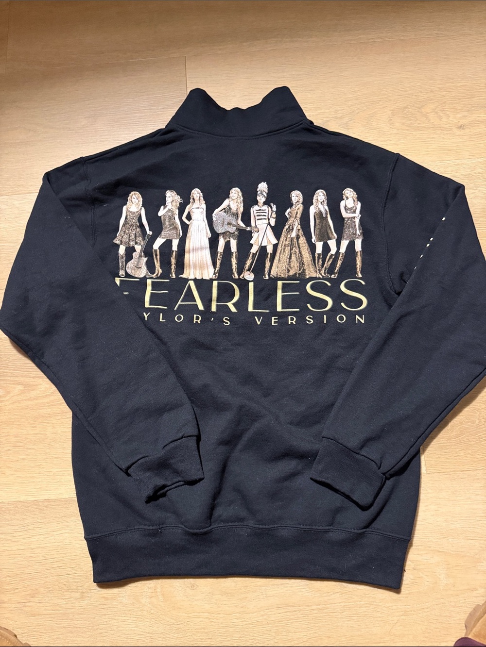 Taylor Swift Black Half-Zip Sweatshirt with Gold Sleeve Logo